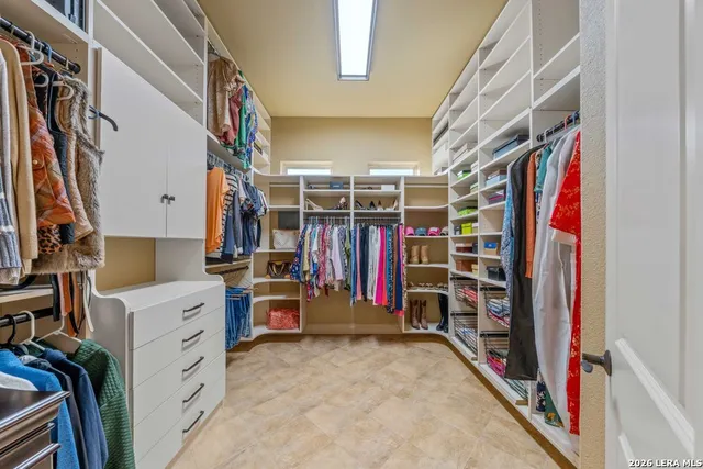 a bathroom with a sink a toilet and a shower