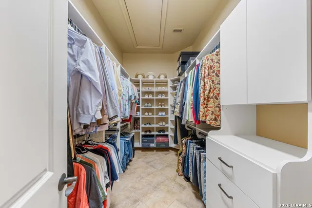 a bedroom with furniture and a wooden floor