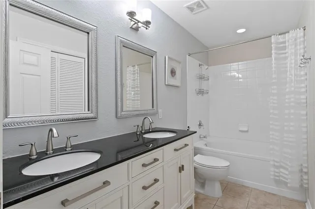 a living room with furniture and a mirror