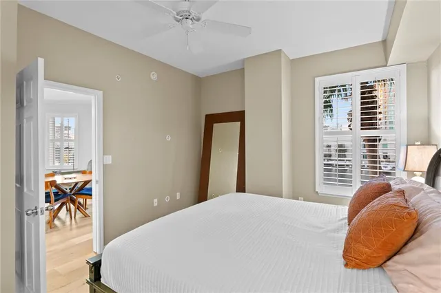 a bedroom with a bed and a chair