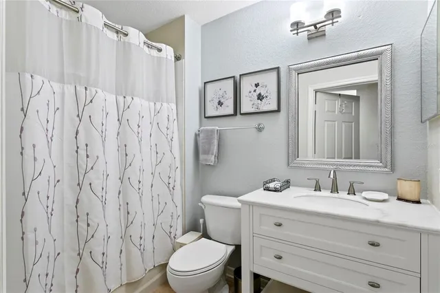 a couple of people sitting in front of a house