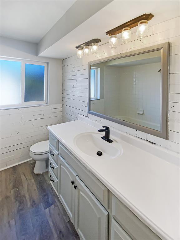 10454 138th Street Largo, FL 33774 - Photo 17 of 35 a bathroom with a sink and a mirror