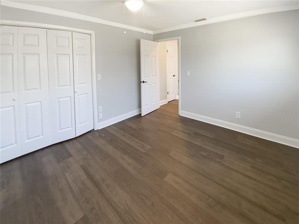 10454 138th Street Largo, FL 33774 - Photo 30 of 35 a view of an empty room with wooden floor