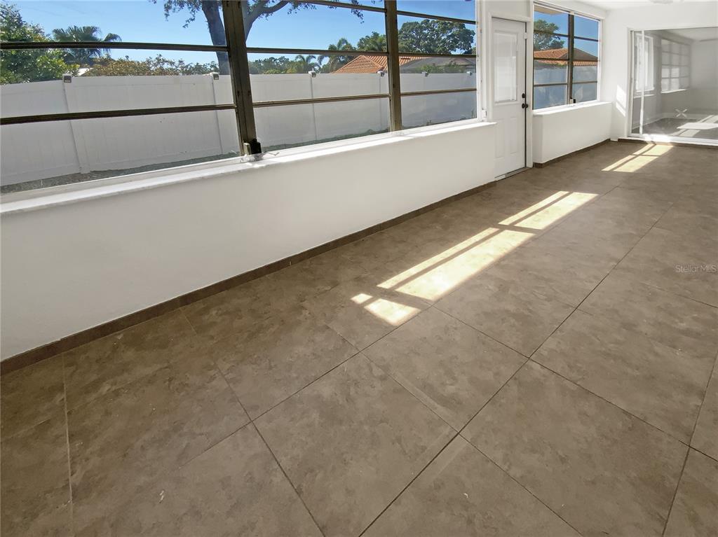 10454 138th Street Largo, FL 33774 - Photo 31 of 35 a view of an outdoor space with swimming pool