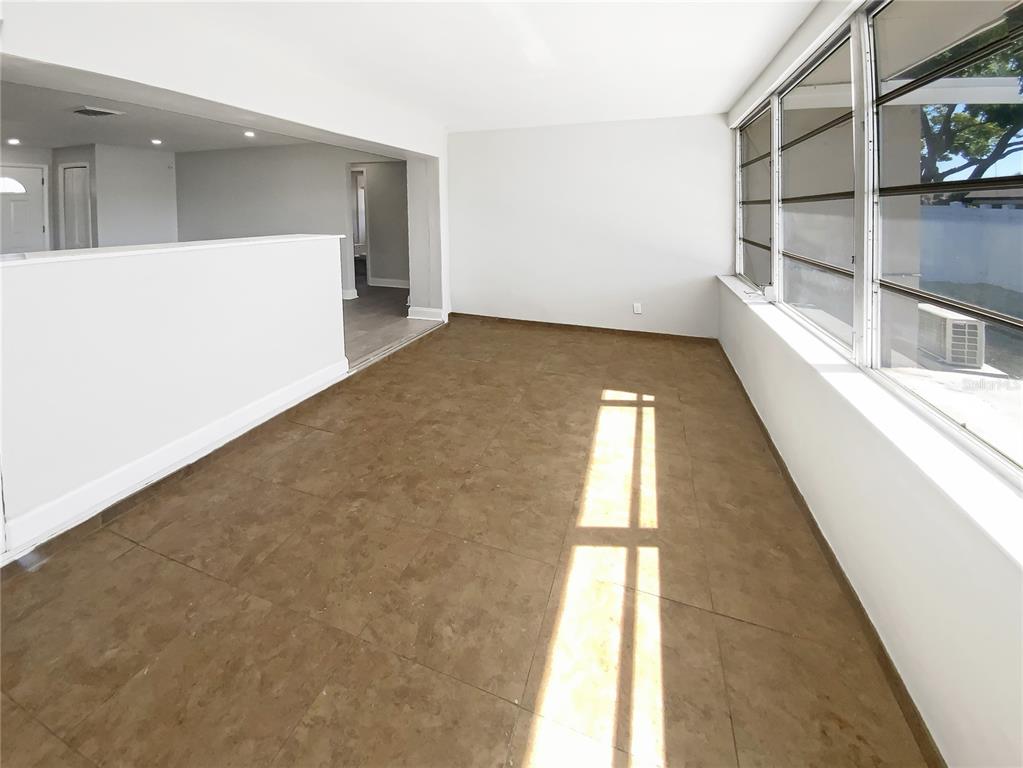 10454 138th Street Largo, FL 33774 - Photo 33 of 35 wooden floor in an empty room with a window