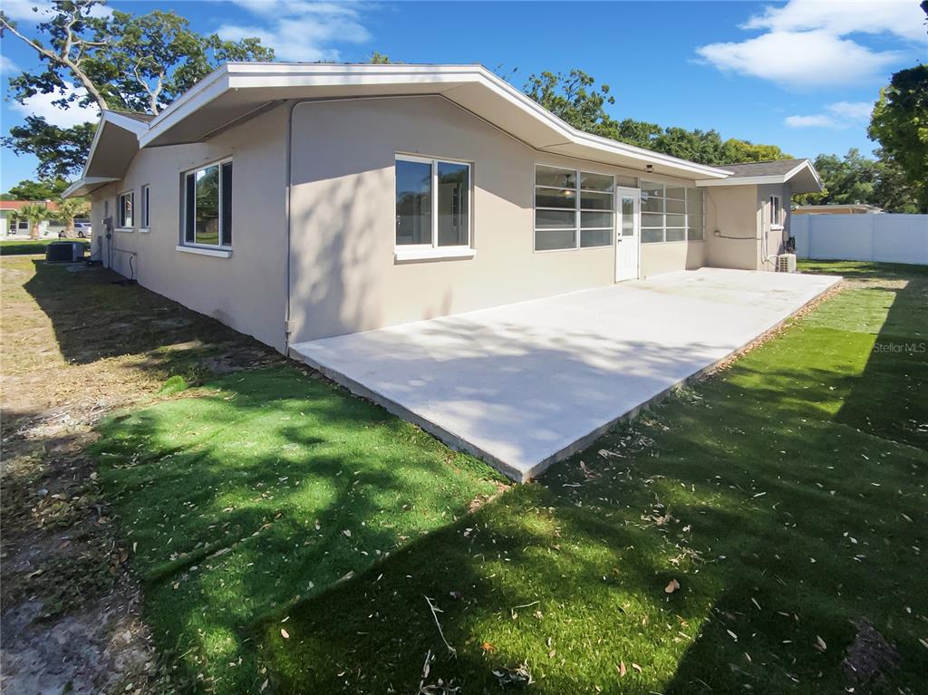10454 138th Street Largo, FL 33774 - Photo 35 of 35 a front view of house with yard and green space