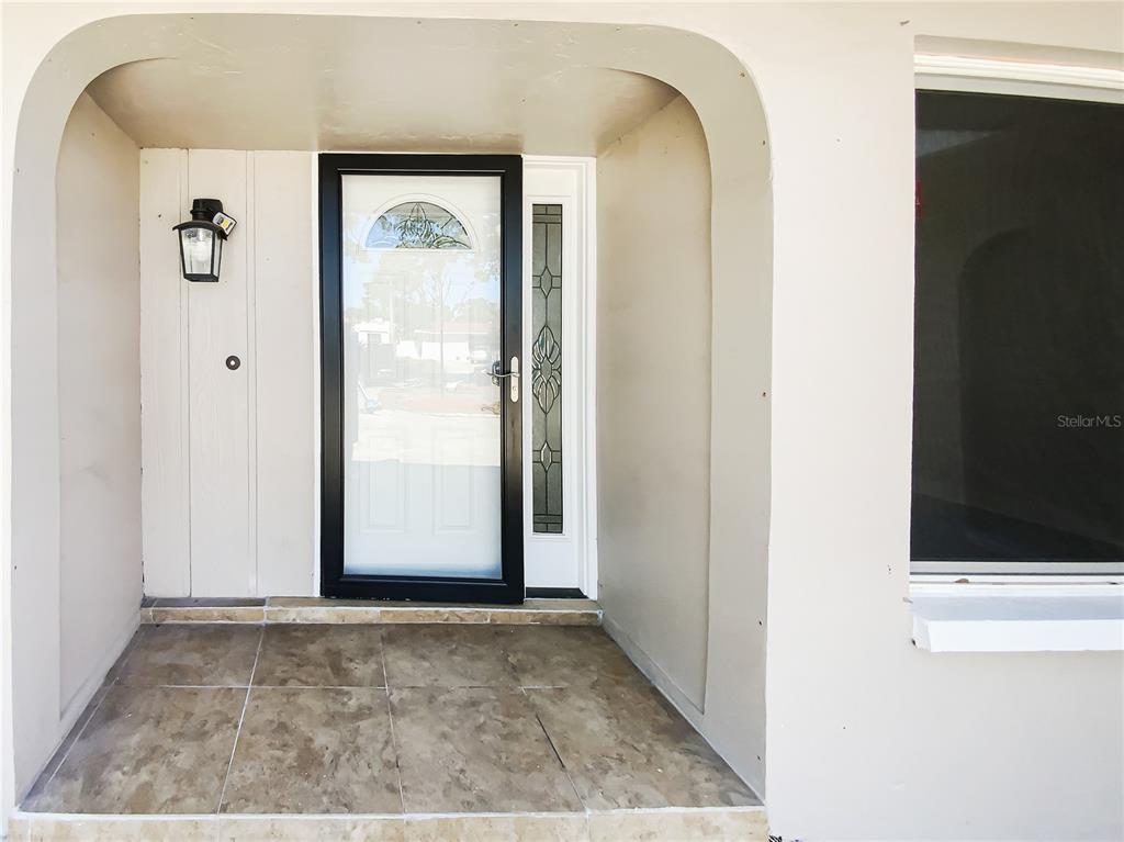 10454 138th Street Largo, FL 33774 - Photo 6 of 35 a view of a hallway to rooms
