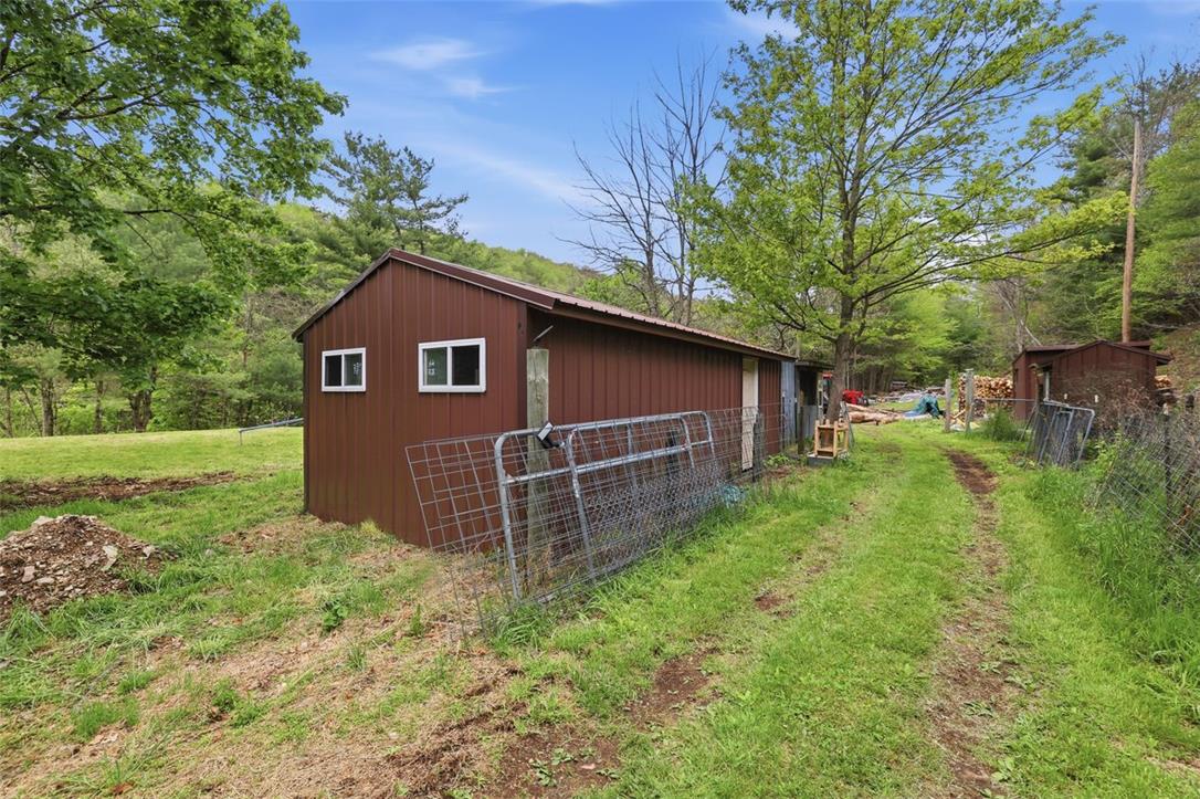 3585 Fairyland Road Lehighton, PA 18235 - Photo 11 of 57 a view of a house with a yard plants and large tree