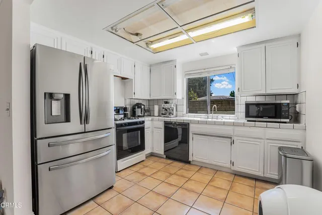a bedroom with a bed and a flat screen television