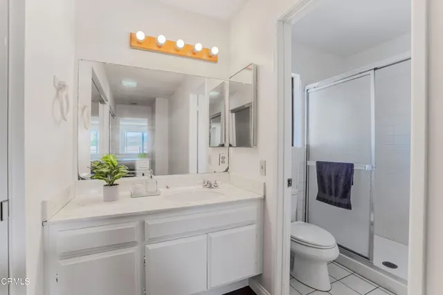 a bathroom with a shower and a window