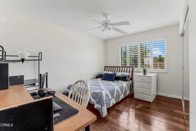 a large bedroom with a bed and a window