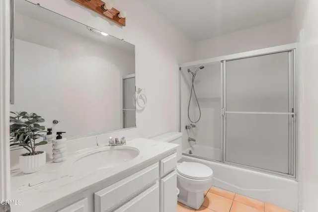 a view of a workspace with furniture and wooden floor
