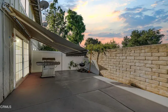 a view of an chair and table in the balcony