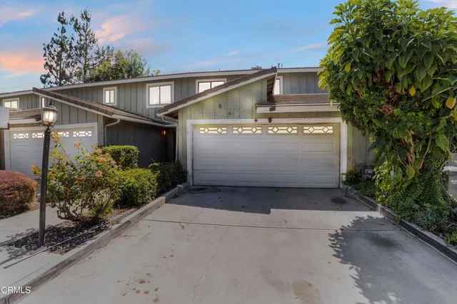 an aerial view of residential house and green space