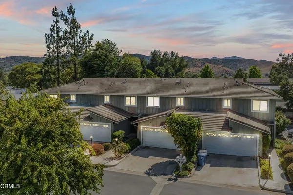 an aerial view of residential houses and outdoor space