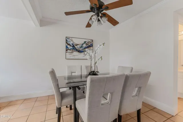 a kitchen with cabinets stainless steel appliances and a window