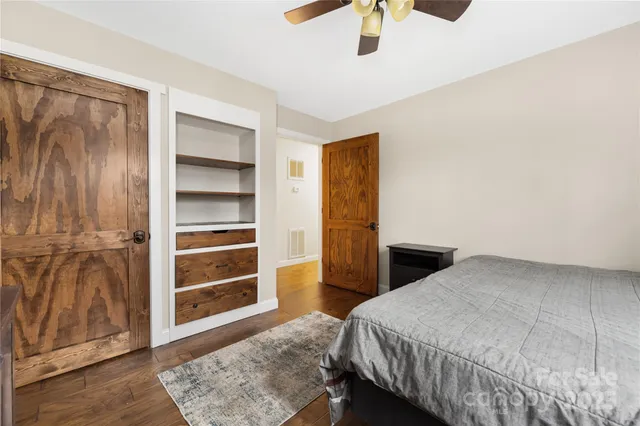 a bedroom with a bed and a walk in closet