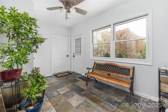 a bench sitting in a room next to a window