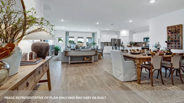a dining room with furniture and wooden floor