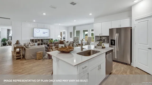 a kitchen with a sink a stove and cabinets