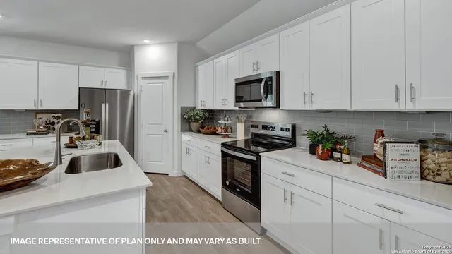 a kitchen with a table and chairs