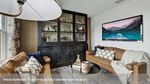 a bedroom with furniture and wooden floor