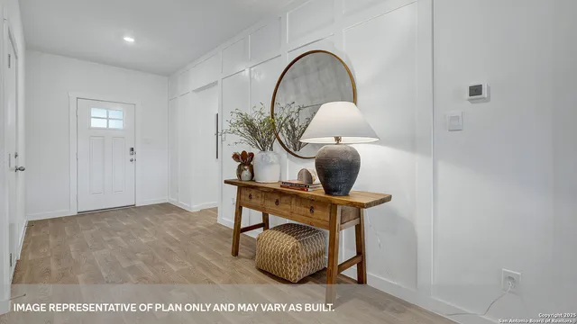 a bed room with a bed and a potted plant