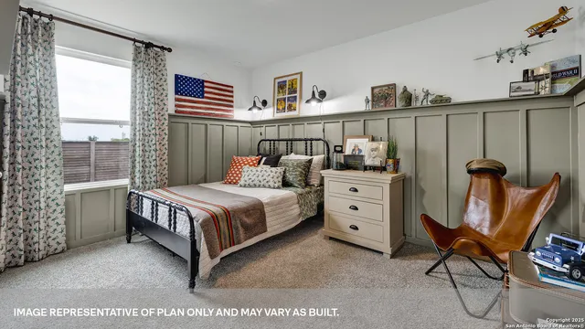 a living room with furniture a rug and a wall painting