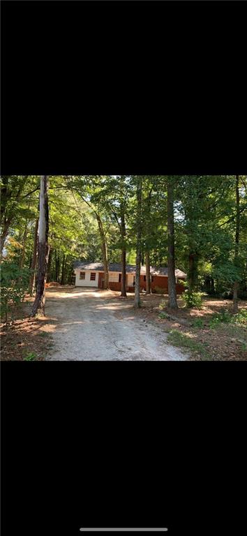 5727 Whispering Pines Road Mableton, GA 30126 - Photo 1 of 1 a view of swimming pool from a yard