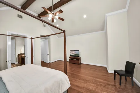 a bedroom with a bed and a chair