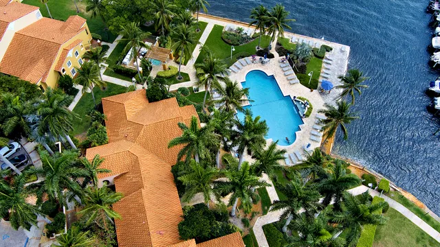 an aerial view of a house with a yard and garden