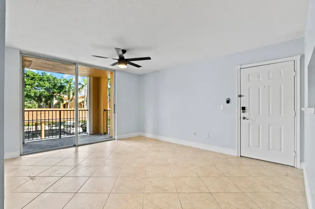 a front view of a residential apartment building with a yard
