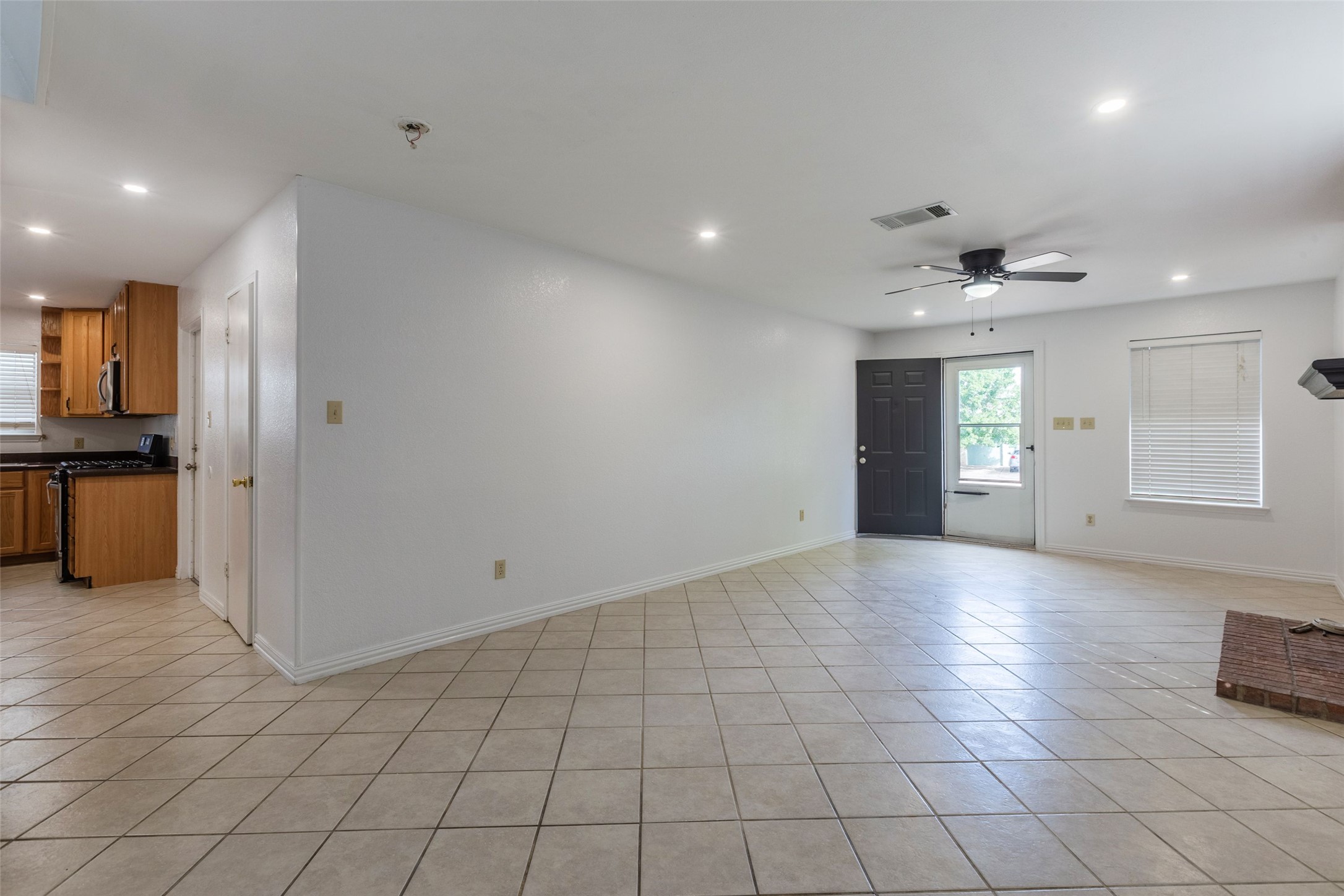8506 Bisbee Court Austin, TX 78745 - Photo 3 of 20 Spacious main living area featuring neutral tile flooring and recessed lighting