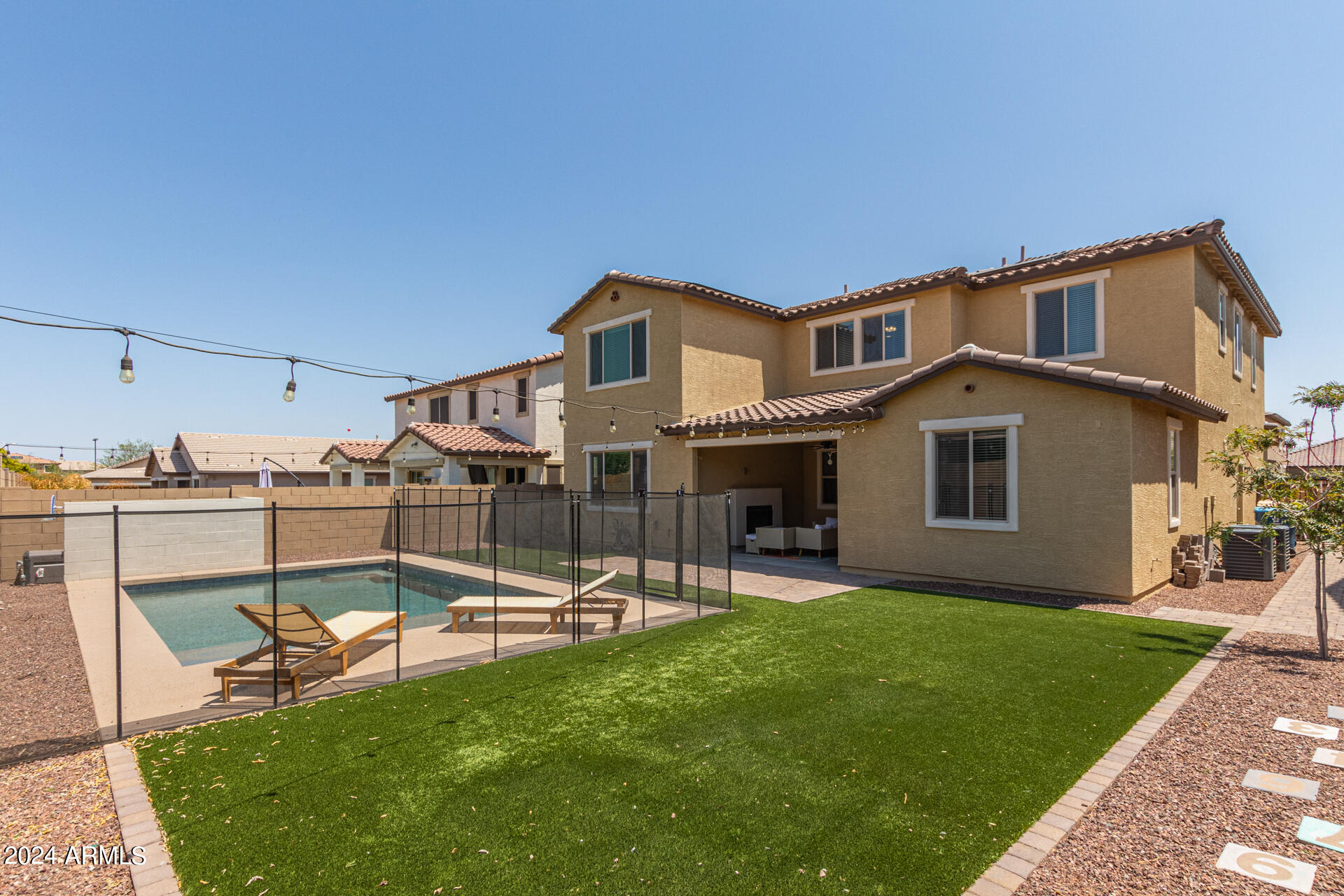 a view of a house with a yard porch and sitting area