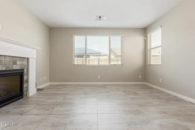a kitchen with granite countertop white cabinets and sink
