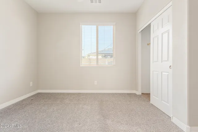 a view of a hallway with stairs