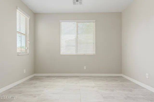a bathroom with a sink vanity and a mirror