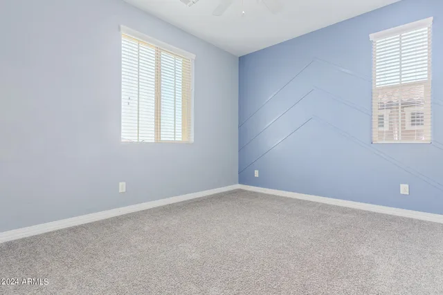 a hallway with cabinet and windows