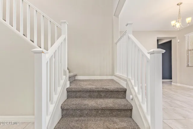 a view of a backyard with floor to ceiling window