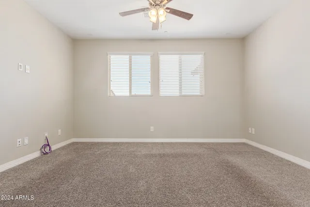 a view of a swimming pool with a patio and a yard