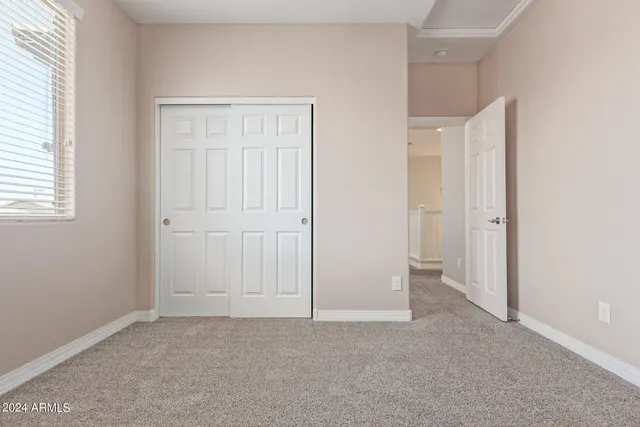 a view of a patio with a table and chairs