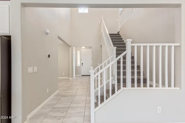 a view of a hallway with staircase