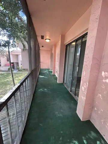 a view of swimming pool from a balcony