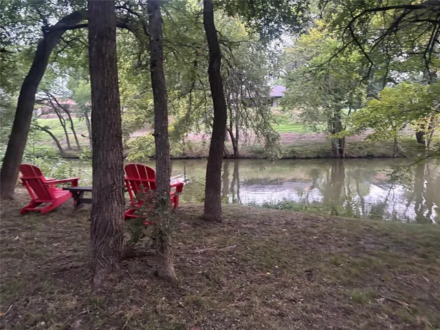a childrens park with lots of swings slides and swimming pool