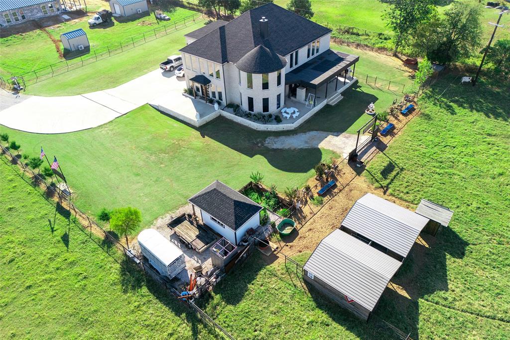 2630 Rockhill Road Aubrey, TX 76227 - Photo 3 of 36 an aerial view of a house with a big yard