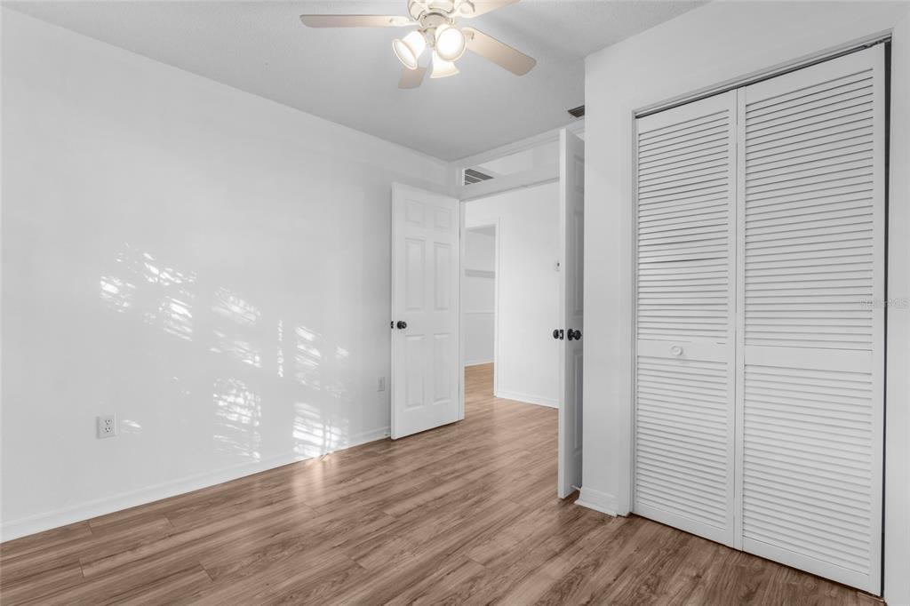 4644 Sawgrass Boulevard New Port Richey, FL 34653 - Photo 14 of 34 a view of a hallway with wooden floor
