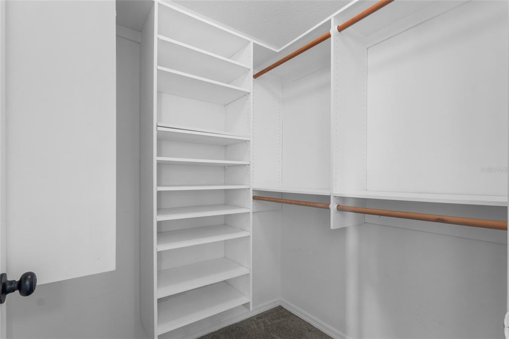 4644 Sawgrass Boulevard New Port Richey, FL 34653 - Photo 15 of 34 a view of walk in closet with empty racks