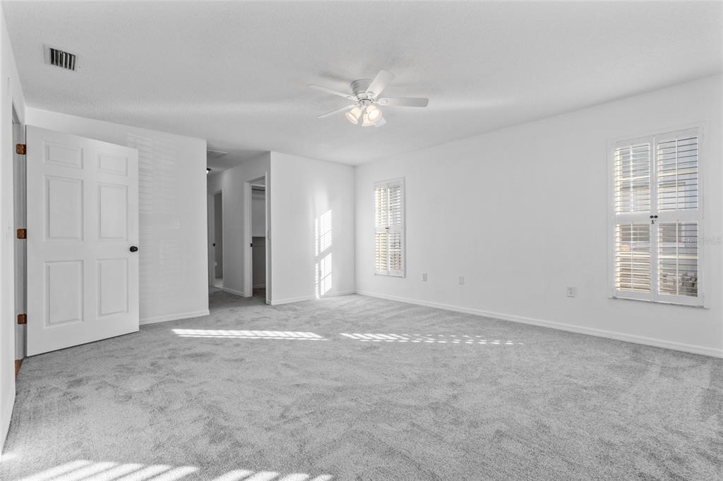 4644 Sawgrass Boulevard New Port Richey, FL 34653 - Photo 20 of 34 a view of a livingroom with a ceiling fan and window