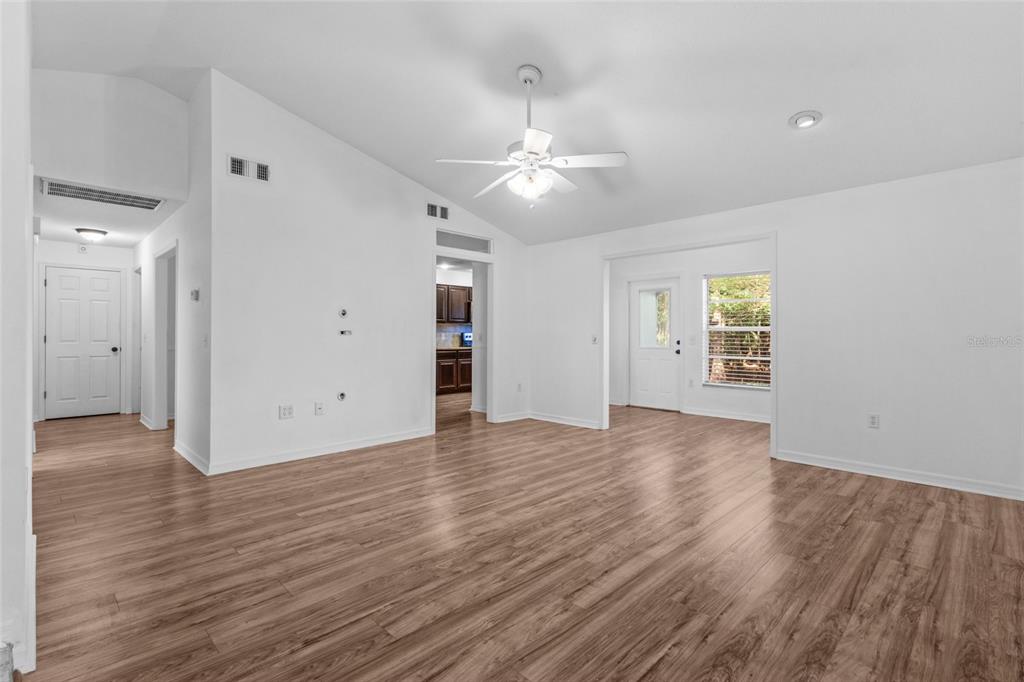 4644 Sawgrass Boulevard New Port Richey, FL 34653 - Photo 22 of 34 wooden floor in an empty room with a window