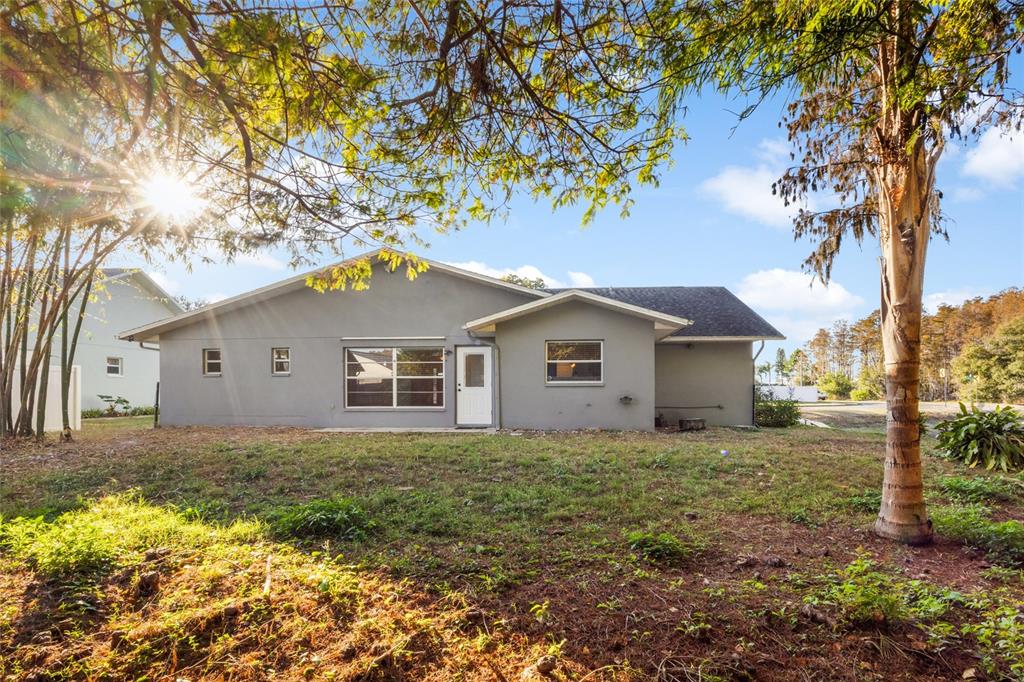 4644 Sawgrass Boulevard New Port Richey, FL 34653 - Photo 26 of 34 a house with a tree in front of it